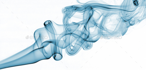 Blue abstract smoke from the aromatic sticks on a white background