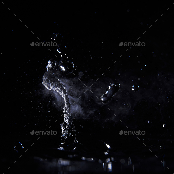 Boiling water splash with steam on black background closeup Stock Photo ...