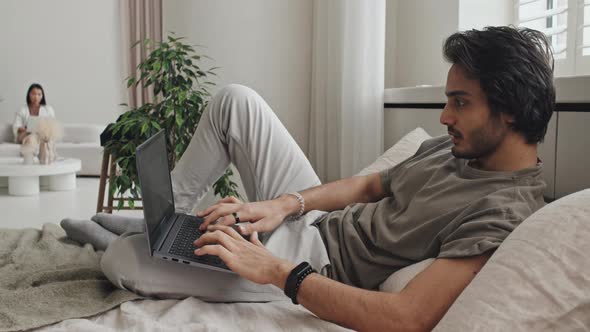 Young Man Video Calling on Bed alt