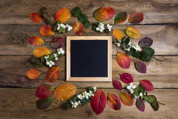 Square wooden frame mockup with fall leaves - Stock Photo - Images