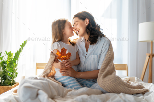 girl and mother enjoying sunny morning - Stock Photo - Images