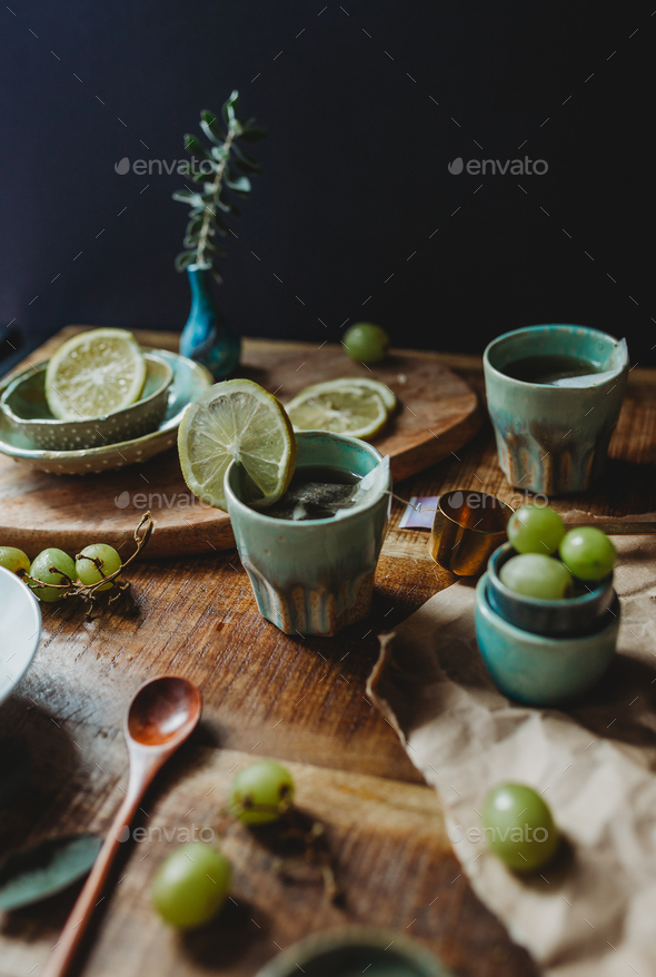 Arrangement of ceramic utensil on wood table Stock Photo by ADDICTIVE_STOCK