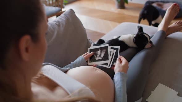 Pregnant woman looking on medical scans. Shot with RED helium camera in 8K alt