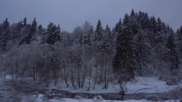 Traveling By Train Snowy Woods With River
