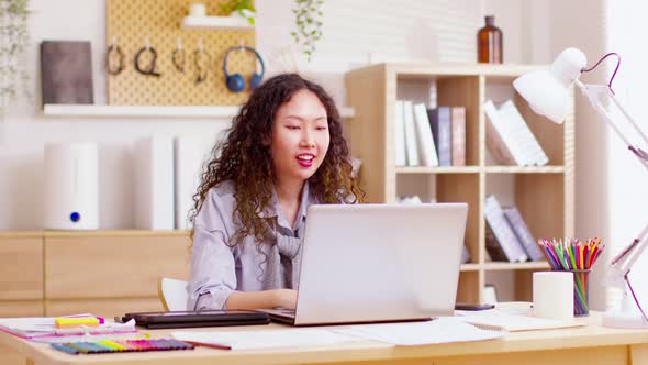 Long Curly hair woman doing online video chat call record vlog blog talking to camera looking at web alt