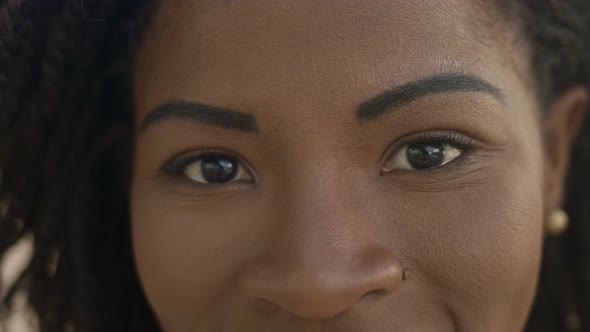 Closeup Shot of Smiling African American Woman Looking at Camera alt