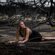 Woman posing on ground near dry trees - PhotoDune Item for Sale
