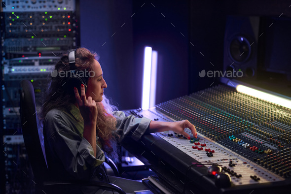 Woman writing music in studio