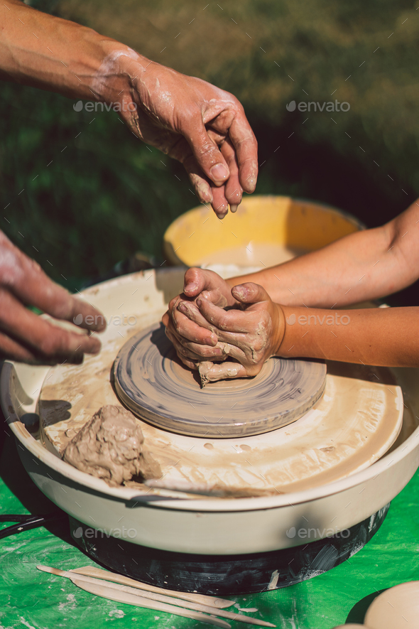 Potter making a clay object on pottery wheel Stock Photo by  StiahailoAnastasiia