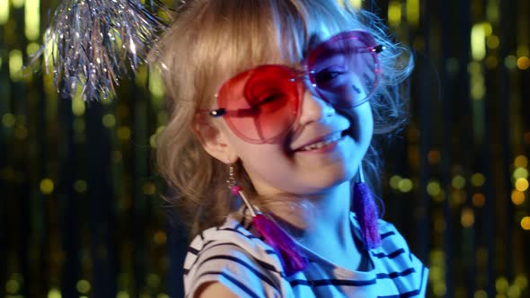 Hipster Cute Teenager Children Girl Looking at Camera Smiling at Disco Party Club in Neon Lighting alt