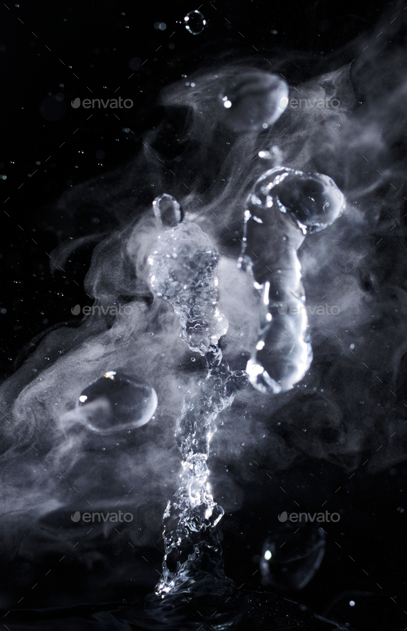 Boiling water splash with steam on black background closeup Stock Photo ...