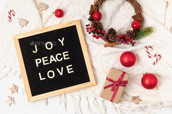 Felt letter board with text joy, peace, love and christmas gifts, decoration