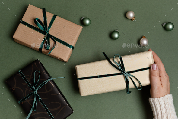 Christmas background with gift boxes and kraft wrapping paper Stock Photo  by OksaLy