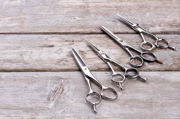 Stylish hairdresser tools on wooden background. Stock Photo by  stockfilmstudio