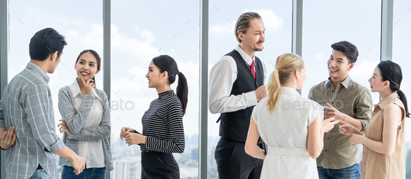 Group of business people rest & relax after meeting stand in high rise skyscraper building