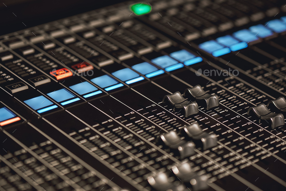Volume control. Close-up view of sound console buttons for volume setting in sound recording studio - Stock Photo - Images