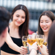 Group of young friends boy and girls drinking wine alcohol, having party at rooftop restaurant. - PhotoDune Item for Sale