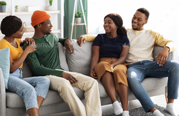 Cheerful african american millennial friends having home party - Stock Photo - Images