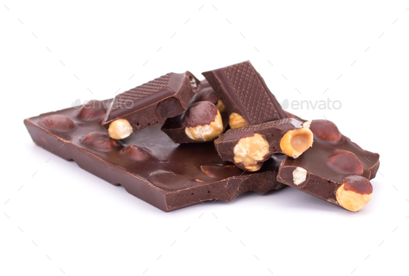 Stack of chocolate pieces with nuts isolated on white background