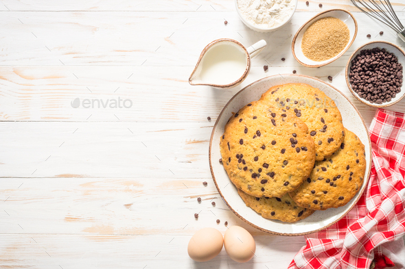Giant cookies with chocolate chips at white table - Stock Photo - Images