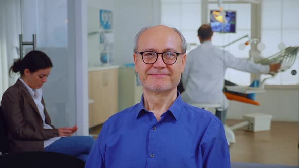 Senior Man Looking at Camera Smiling alt