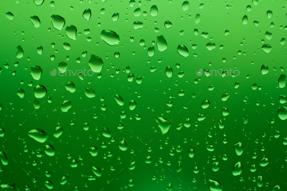 Water drops on green background closeup focus and no-focus