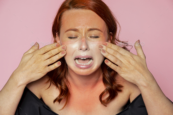 Face mask tan line on an upset woman face