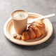 Cup of hot coffee and fresh croissant in disposable craft paper tableware - PhotoDune Item for Sale
