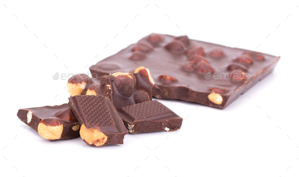 Stack of chocolate pieces with nuts isolated on white background