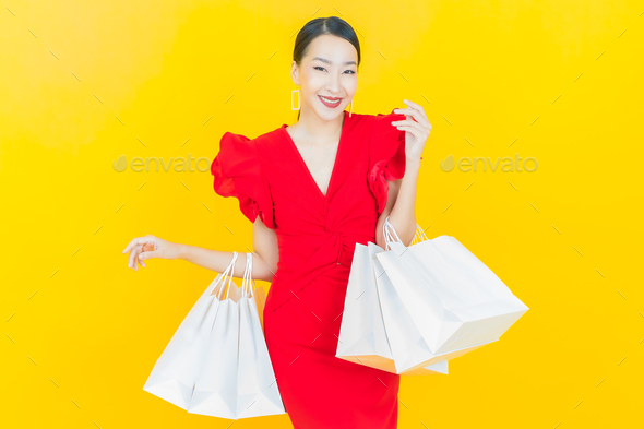 Portrait beautiful young asian woman smile with shopping bag - Stock Photo - Images