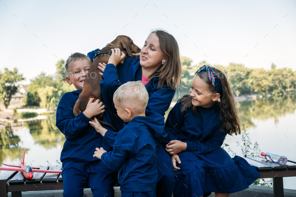Large Family Parenting, Single Mom with large family. Single mum and three kids playing together