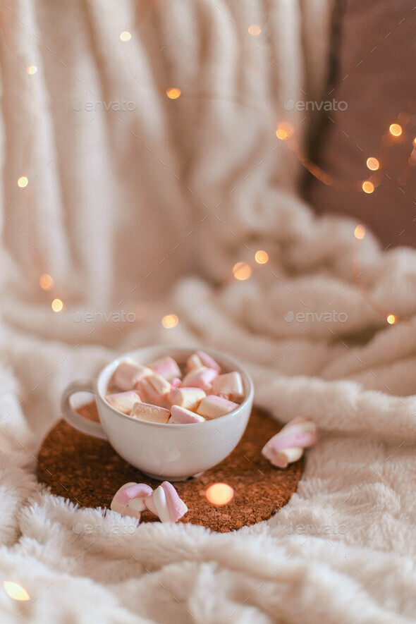 chocolate or aromatic cocoa drink with marshmallow sweets in a mug on a
