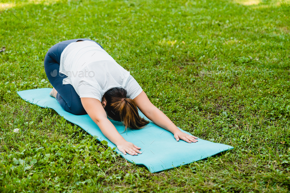 Slimming burning calories losing weight exercises. Ahlete stretching, doing yoga training workout