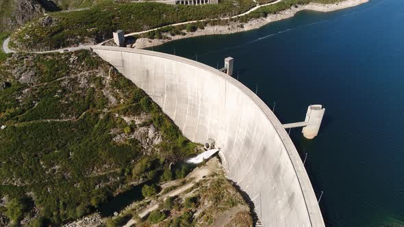 Modern Dam Reservoir on Blue Lake Waters Generate Alternative Energy in Highland Wild Area alt