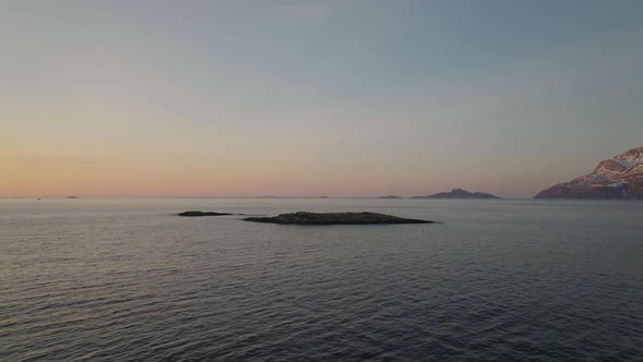 Aerial view of Island in the artic circle ocean. Tromvik, Kvaloya, Northern Norway, alt