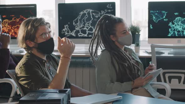 Businessman Asking Question during Meeting in Office alt