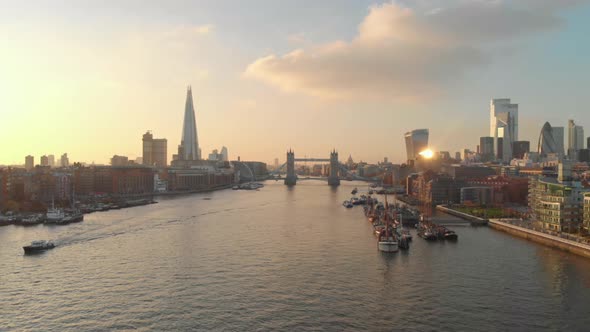 dolly forward drone shot London city centre tower bridge shard gherkin at sunset alt