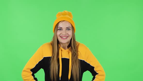 Portrait of Modern Girl in Yellow Hat in Anticipation of Worries, Then Disappointed and Upset. Green alt