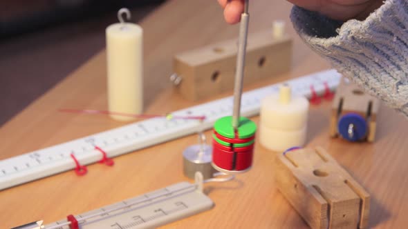Closeup Hands of a Student Hold and Study the Physical Load alt