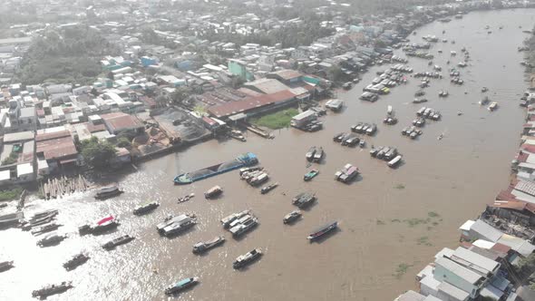 Aerial: rotating panorama over Cai Rang floating market Can Tho Vietnam alt