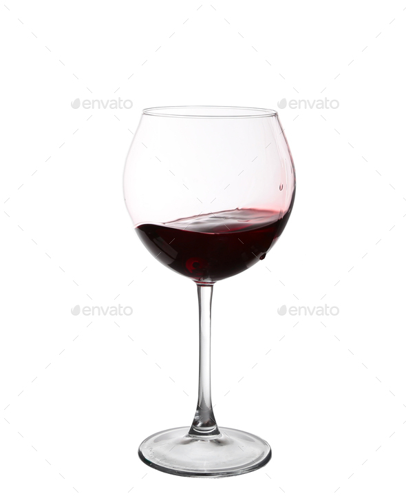 red wine swirling in a goblet wine glass, isolated