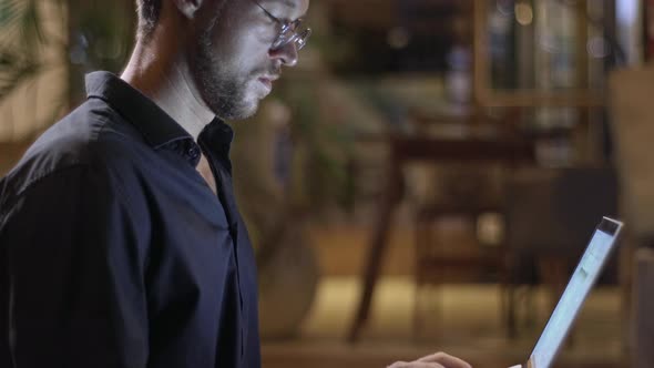 Man in Dark Room alt