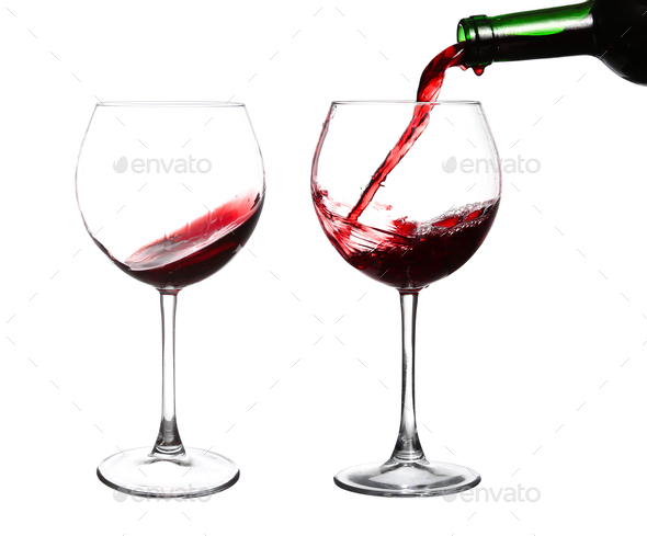red wine swirling in a goblet wine glass, isolated on a white background