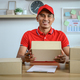 Male employee authenticates customers to deliver parcels. - PhotoDune Item for Sale
