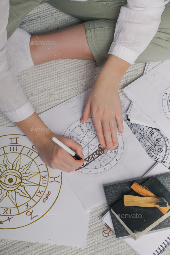 Astrology. Astrologer calculates natal chart and makes a forecast of