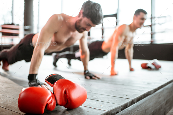 Boxers doing push-ups at the gym - Stock Photo - Images