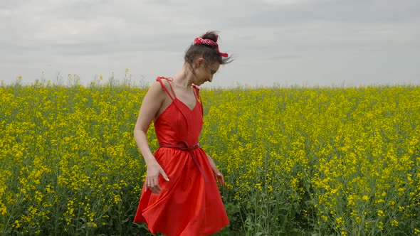 Young Sexy Woman in Red Dress Dancing alt