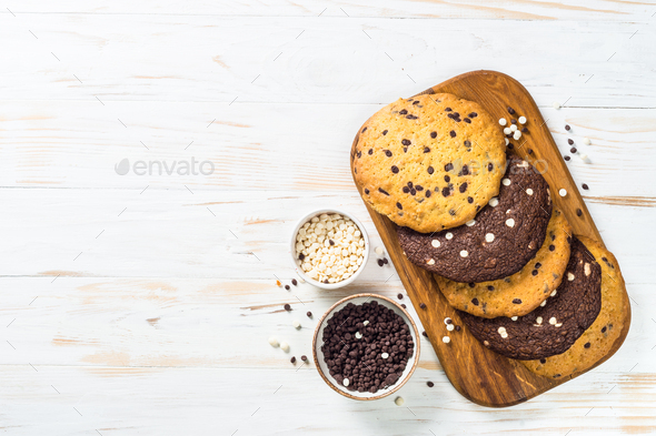 Giant cookies with chocolate chips at white table - Stock Photo - Images