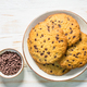 Giant cookies with chocolate chips at white table - PhotoDune Item for Sale