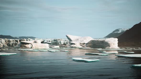 Blue Icebergs of Antarctica with Frozen and Snow Covered Antarctic Scenery alt